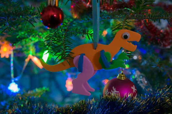 Dino Christmas-Tree Decorations on a Christmas-Tree Branch with Christmas Balls and Christmas-Tree Set
