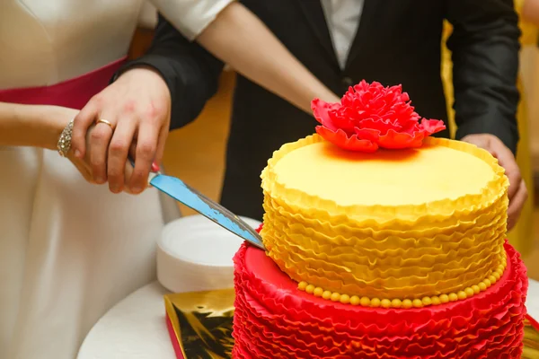 Bride and Groom at Wedding Reception Cutting the Wedding Cake