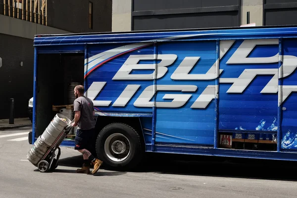 Delivery worker with beer barrels