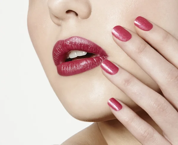 Mouth with fuchsia pink lipstick