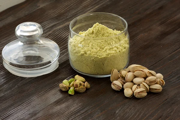 Flour in a jar of green pistachios and pistachio