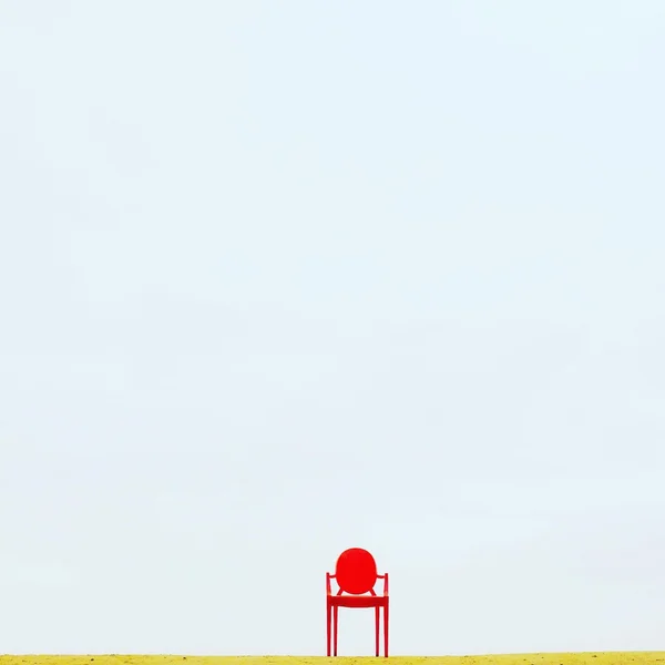 Red chair standing on yellow floor