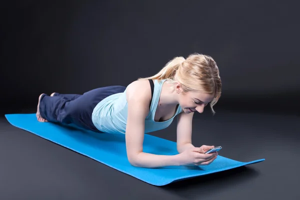 Girl exercise lying on yoga mat