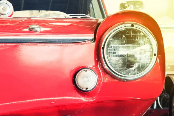 Close Up of Headlight Lamp Vintage Classic Car. (Vintage Effect Style)