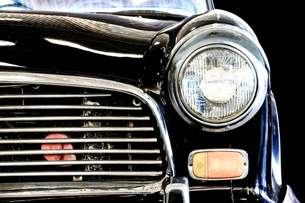 Close Up of Headlight Lamp Black Vintage Classic Car. (Vintage Effect Style)