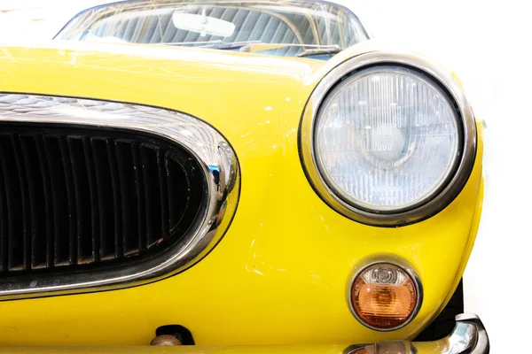 Close Up of Headlight Lamp Yellow Vintage Classic Car. (Vintage Effect Style)