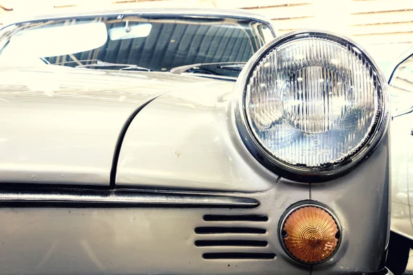 Close Up of Headlight Lamp Silver Vintage Classic Car. (Vintage Effect Style)