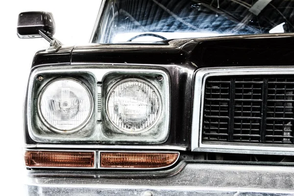 Close Up of Headlight Lamp Dark Brown Vintage Classic Car. (Vintage Effect Style)