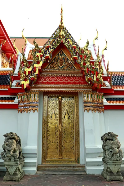 Golden isosceles structure, Delicate painted of Thai Temple Door Entrance and Lion Historic Chinese stone sculpture of a Chinese warrior sculpture