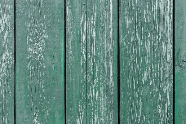 Different shades of green texture wood planks as a background nature. Peeling paint on an old green wooden boards. The texture of old wood as background. Country style.