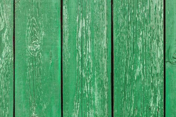 Different shades of green texture wood planks as a background nature. Peeling paint on an old green wooden boards. The texture of old wood as background. Country style.