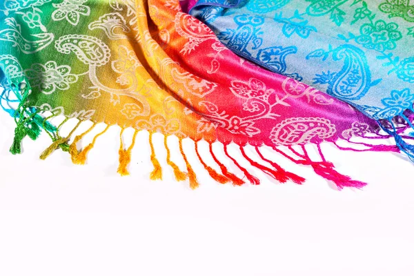 The colors of the rainbow bands on Indian fabric as a background