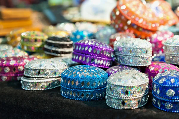 Various of different colorful jewel boxes in Indian market
