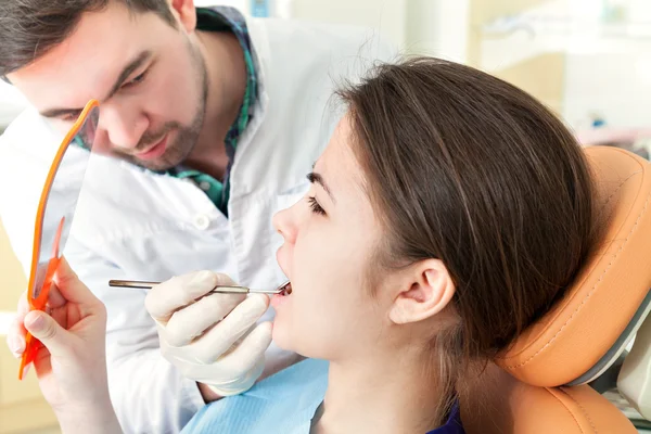 The girl on reception at the dentists chair.