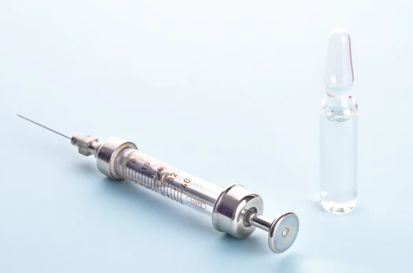 Vintage insulin syringe with insulin vial