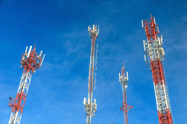 Antenna and cellular tower in blue sky