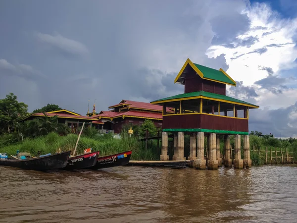 INLE LAKE, MYANMAR - MAY 25, 2014 : Village, boat and local people lifestyle at Inle Lake Pier