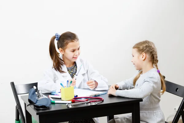 Children playing doctor and patient