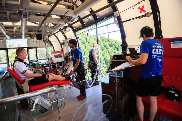 The man is jumping swallow type from 207 metres height, freestyle-bungy