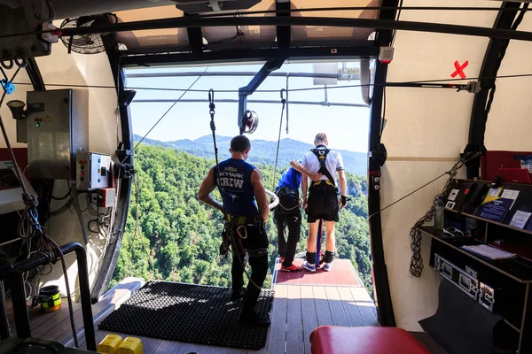 The man is jumping swallow type from 207 metres height, freestyle-bungy