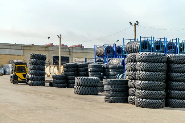 The forklift in the warehouse with the tires