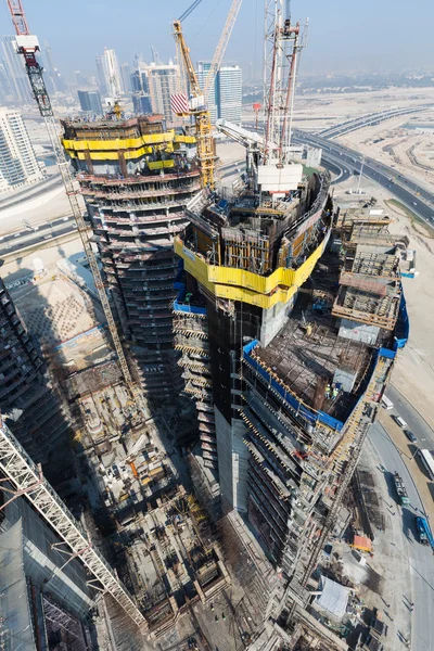 United Arab Emirates, Dubai, 05/21/2015, Damac Towers Dubai by Paramount, construction and building ariel views with cityscape background