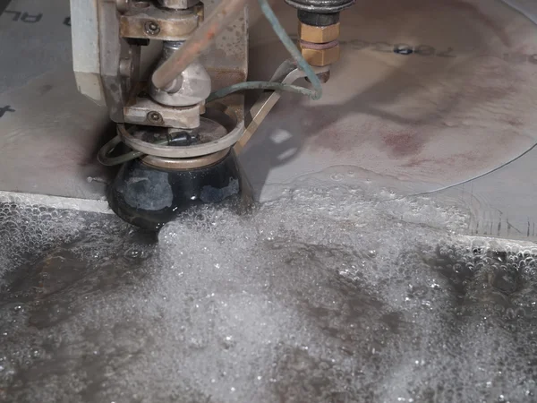 Water pressure cutting through stainless steel materials