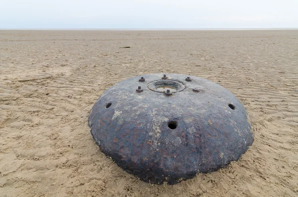 Big metal world war underwater contact mine on a beach in lancashire, england