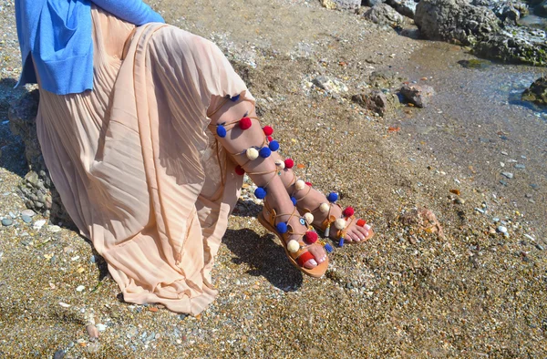 Woman advertises traditional greek sandals