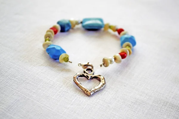 Gemstone bracelet with silver heart