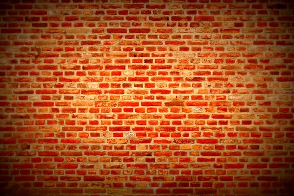 Brick wall horizontal background with red, orange and brown bricks - dark red