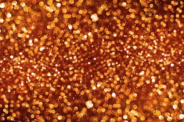Rose gold glitter bokeh texture abstract background