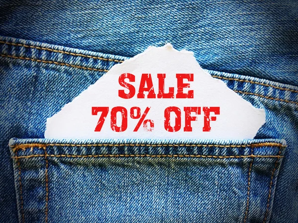 70% off on white paper in the pocket of blue denim jeans
