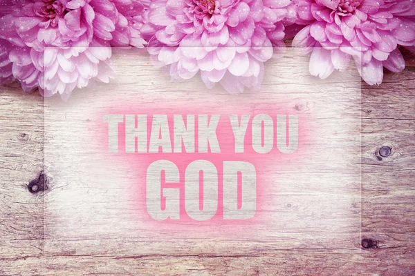 Pink flowers on wooden with word THANK YOU GOD