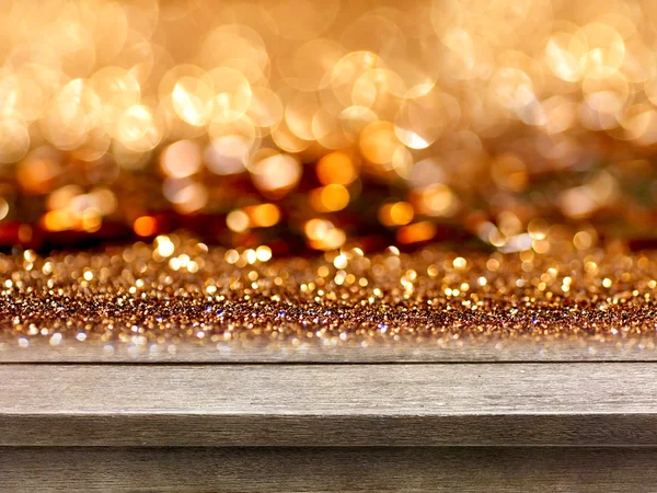 Old wood table top on rose gold glitter bokeh background