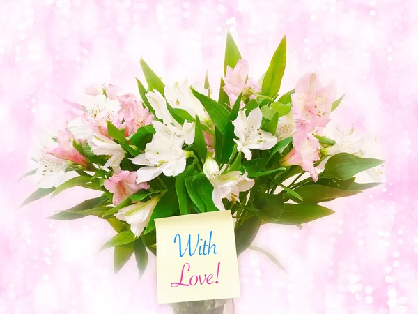 Bouquet of pink and white flowers on pink glitter bokeh backgrou