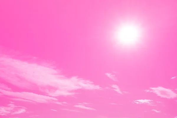 Bright gradient pink sky with sun shining