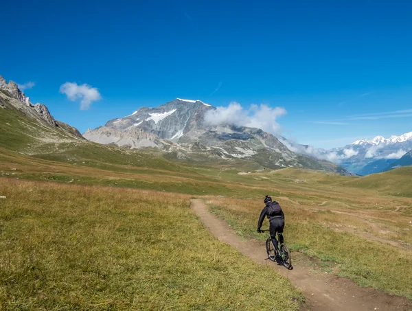 Riding mountain bicycle through mountains