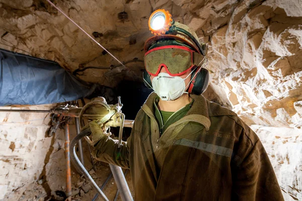Miner inside a gold mine.