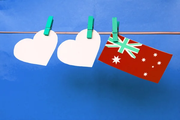 White two hearts and Australian flag hanging on pegs ( clothespi