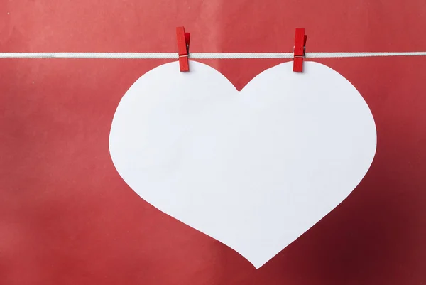 Lovely red hearts - big white Heart hanging on the clothesline.