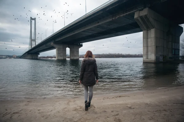 Girl walking near the South bridge in Kiev.