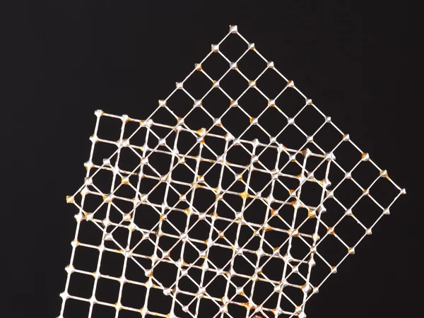 Two tin wire grids with practice solder joints