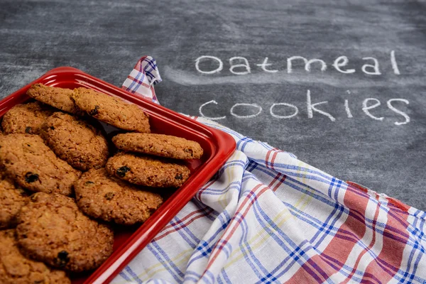 Sweet oatmeal cookies in red tray