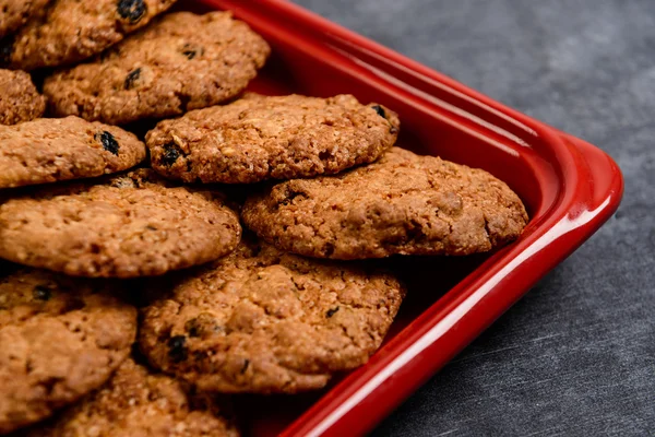 Sweet oatmeal cookies in red tray