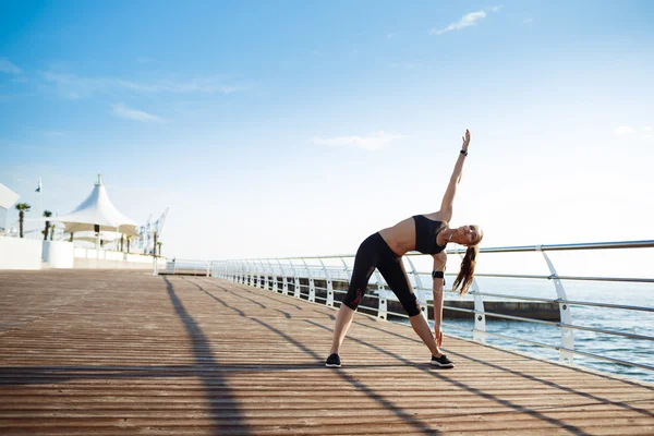 Fitness girl makes sport exercises