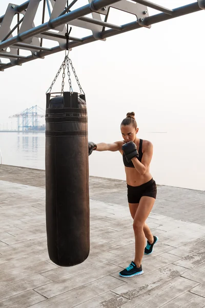 Woman training boxing