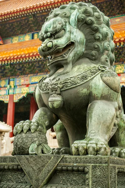Asian lion statue outside traditional palace