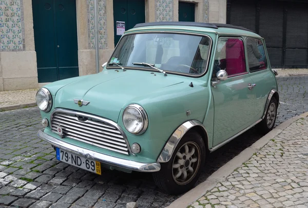 Classic light blue Austin Mini motorcar in the streets of Lisbon Portugal.