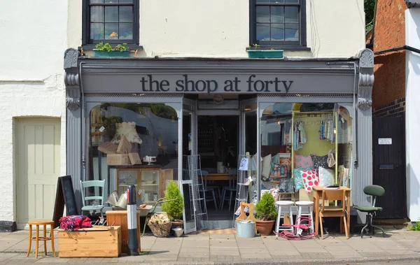 Store front of The Shop at Forty which sells Retro and Vintage wares with stock outside on the pavement.